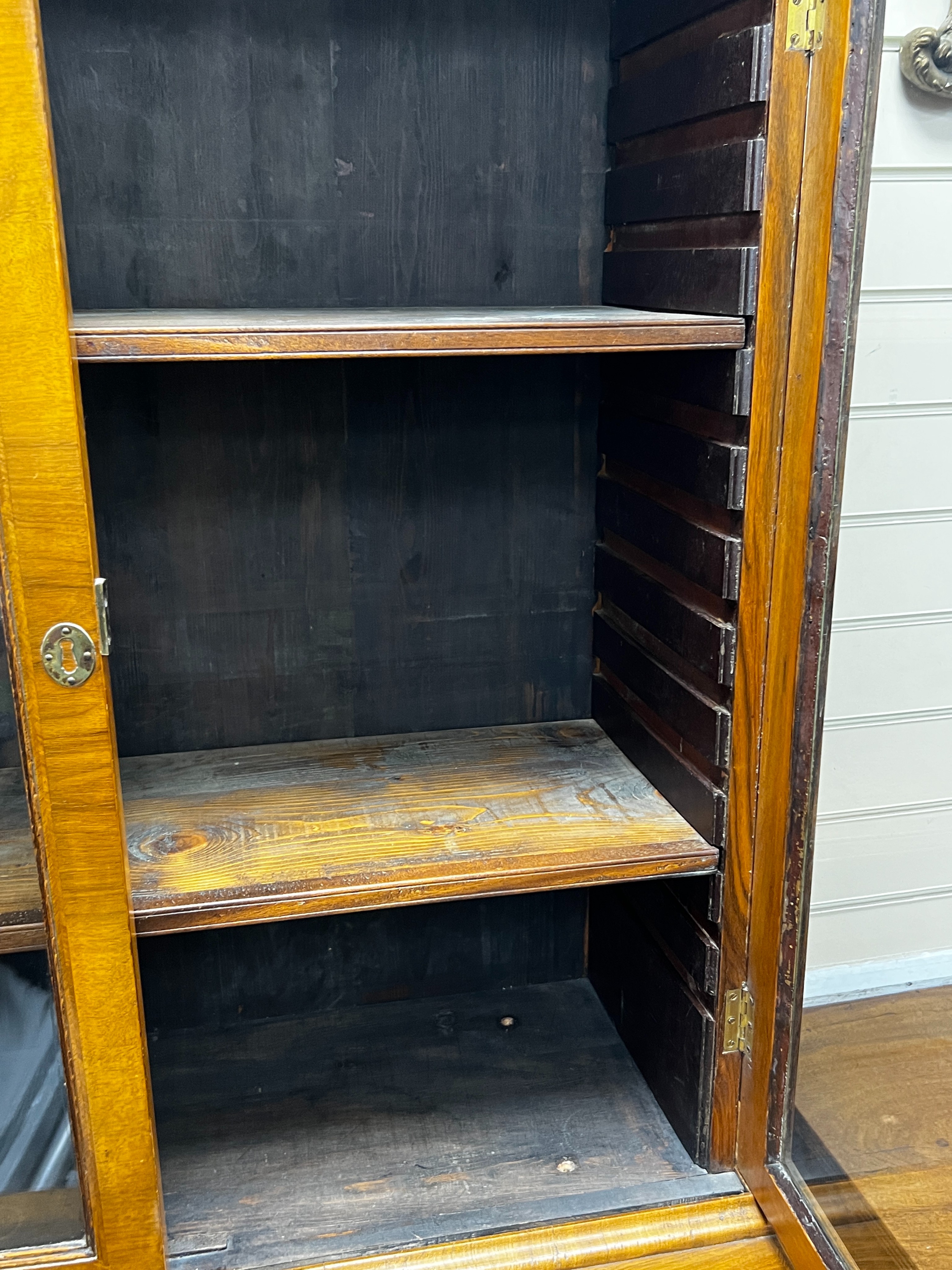 A Queen Anne revival feather banded walnut cabinet on chest, width 91cm, depth 47cm, height 193cm